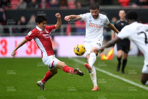 221125 - Bristol City v Swansea City - Sky Bet Championship - Cameron Burgess of Swansea City is challenged by Yu Hirakawa of Bristol City