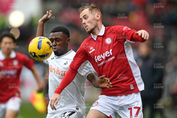 221125 - Bristol City v Swansea City - Sky Bet Championship - Zeidane Inoussa of Swansea City is challenged by Mark Sykes of Bristol City