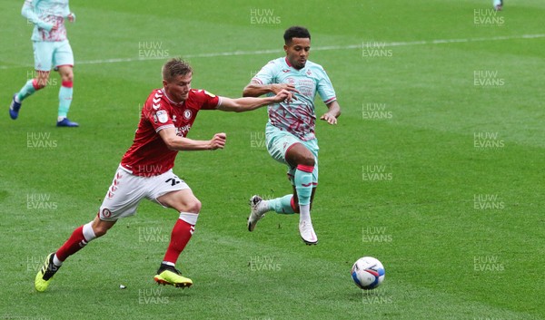 241020 - Bristol City v Swansea City, Sky Bet Championship - Korey Smith of Swansea City and Taylor Moore of Bristol City compete for the ball