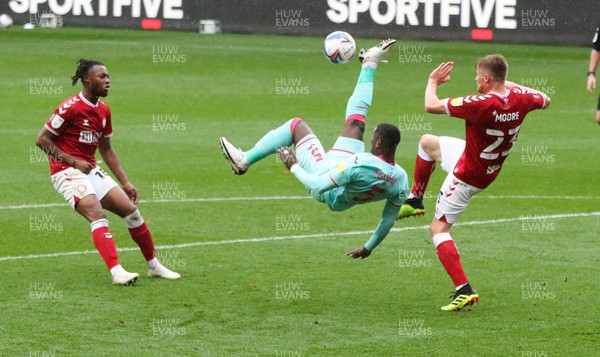 241020 - Bristol City v Swansea City, Sky Bet Championship - Marc Guehi of Swansea City attempts an overhead shot at goal as Taylor Moore of Bristol City closes in