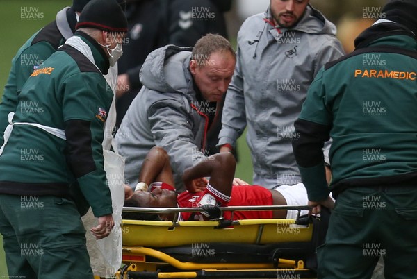 241020 - Bristol City v Swansea City, Sky Bet Championship - Swansea City head coach Steve Cooper consoles Steven Sessegnon of Bristol City as he is stretchered from the pitch after sustaining an injury