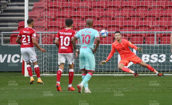 241020 - Bristol City v Swansea City, Sky Bet Championship - Nahki Wells of Bristol City beats Swansea City goalkeeper Freddie Woodman to score from the penalty spot and level the scores