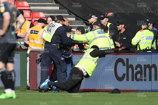 291022 - Bristol City v Swansea City - SkyBet Championship - Trouble in the away end as a pitch invader pushes over a steward
