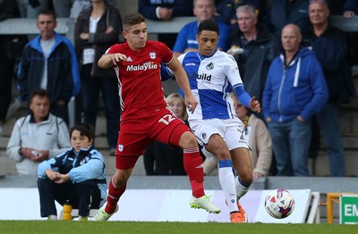 110816 - Bristol Rovers v Cardiff City - EFL Cup - Declan John of Cardiff City tackles Daniel Leadbitter of Bristol Rovers