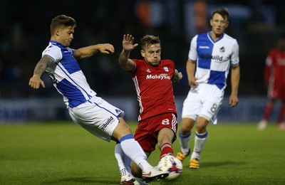 110816 - Bristol Rovers v Cardiff City - EFL Cup - Joe Ralls of Cardiff City is tackled by James Clarke of Bristol Rovers