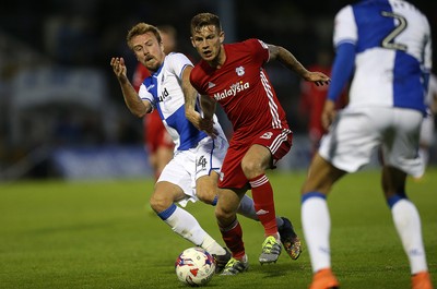 110816 - Bristol Rovers v Cardiff City - EFL Cup - Joe Ralls of Cardiff City is challenged by Chris Lines of Bristol Rovers