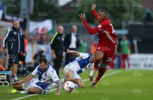 110816 - Bristol Rovers v Cardiff City - EFL Cup - Kenneth Zohore of Cardiff City is challenged by Peter Hartley of Bristol Rovers