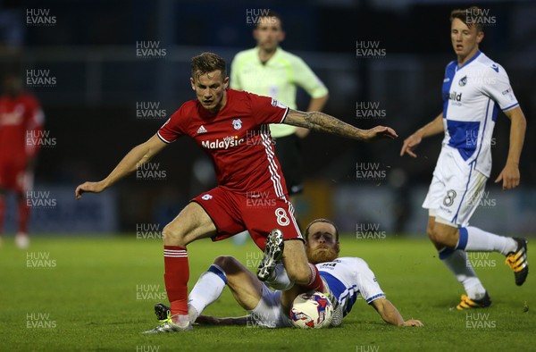 110816 - Bristol Rovers v Cardiff City - EFL Cup - Joe Ralls of Cardiff City is tackled Stuart Sinclair of Bristol Rovers