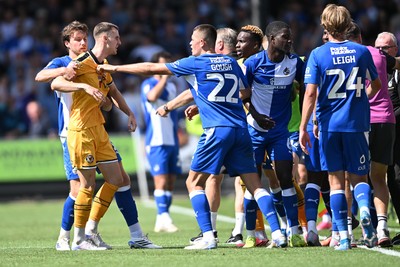 220826 - Bristol Rovers v Newport County - Sky Bet League 2 - Things heat up after Bobby Kamwa of Bristol Rovers scores a goal and runs towards the Newport supporters
