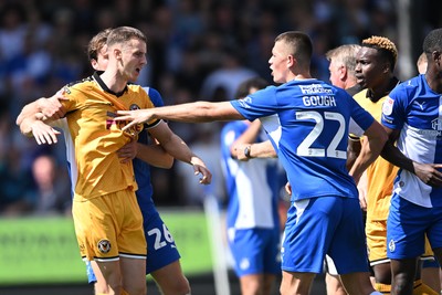 220826 - Bristol Rovers v Newport County - Sky Bet League 2 - Things heat up after Bobby Kamwa of Bristol Rovers scores a goal and runs towards the Newport supporters