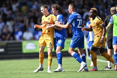 220826 - Bristol Rovers v Newport County - Sky Bet League 2 - Things heat up after Bobby Kamwa of Bristol Rovers scores a goal and runs towards the Newport supporters