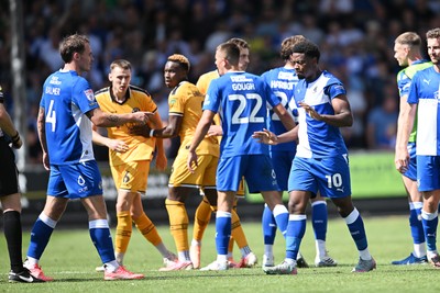 220826 - Bristol Rovers v Newport County - Sky Bet League 2 - Things heat up after Bobby Kamwa of Bristol Rovers scores a goal and runs towards the Newport supporters