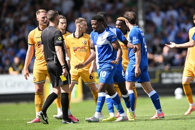 220826 - Bristol Rovers v Newport County - Sky Bet League 2 - Things heat up after Bobby Kamwa of Bristol Rovers scores a goal and runs towards the Newport supporters