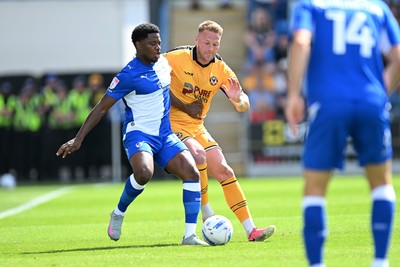 220826 - Bristol Rovers v Newport County - Sky Bet League 2 - Cameron Norman of Newport County is challenged by Bobby Kamwa of Bristol Rovers