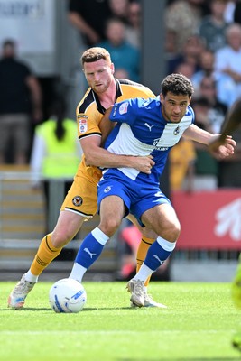 220826 - Bristol Rovers v Newport County - Sky Bet League 2 - Lee Jenkins of Newport County is challenged by Tom James of Bristol Rovers