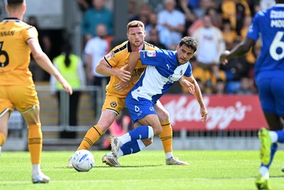 220826 - Bristol Rovers v Newport County - Sky Bet League 2 - Lee Jenkins of Newport County is challenged by Tom James of Bristol Rovers