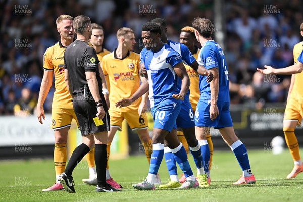 220826 - Bristol Rovers v Newport County - Sky Bet League 2 - Things heat up after Bobby Kamwa of Bristol Rovers scores a goal and runs towards the Newport supporters