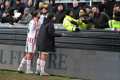 310126 - Bristol Rovers v Newport County - Sky Bet League 2 - Things heat up between Matthew Baker of Newport County, Liam Shepard of Newport County and Newport fans at full time