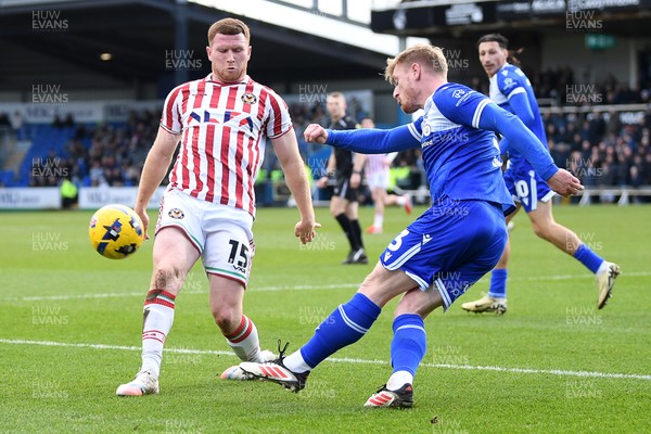 310126 - Bristol Rovers v Newport County - Sky Bet League 2 - Lee Jenkins of Newport County is challenged by Jack Sparkes of Bristol Rovers