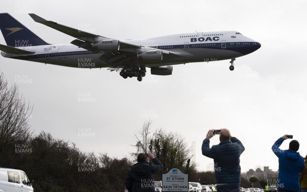 111220 -  Members of the public look on as British Airways specially painted 747 G-BYGC landing at St Athan, South Wales where it is reported to be maintained as a heritage piece
