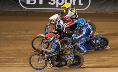 210718 - British FIM Speedway Grand Prix, Cardiff - Riders make their way around the track during the heats at the British FIM Speedway Grand Prix