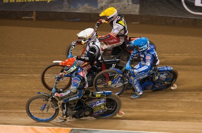 210718 - British FIM Speedway Grand Prix, Cardiff - Riders make their way around the track during the heats at the British FIM Speedway Grand Prix