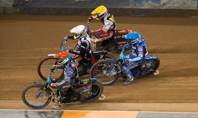 210718 - British FIM Speedway Grand Prix, Cardiff - Riders make their way around the track during the heats at the British FIM Speedway Grand Prix