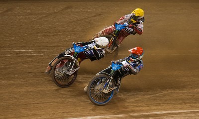 210718 - British FIM Speedway Grand Prix, Cardiff - Riders make their way around the track during the heats at the British FIM Speedway Grand Prix