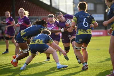 220426 - Brunel v Loughborough - Women's BUCS Final - Amelia Williams of Loughborough is challenged by Lily Ollife of Brunel