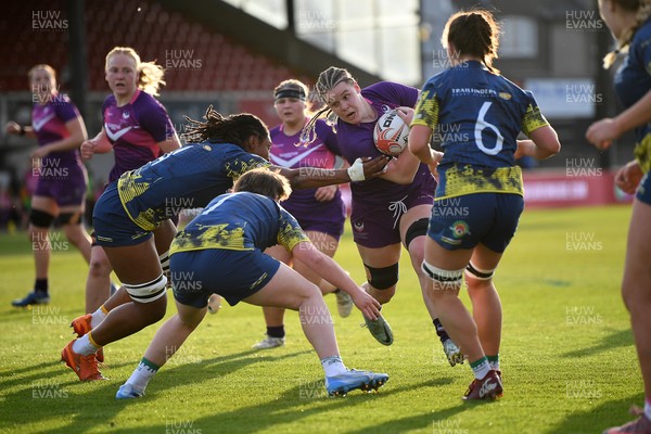 220426 - Brunel v Loughborough - Women's BUCS Final - Amelia Williams of Loughborough is challenged by Lily Ollife of Brunel