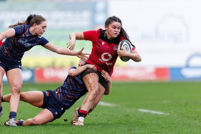 140226 - Brython Thunder v Edinburgh - Celtic Challenge - Jorja Aiono of Brython Thunder is tackled by Emily Love of Edinburgh