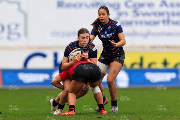 140226 - Brython Thunder v Edinburgh - Celtic Challenge - Cieron Bell of Edinburgh is tackled by Seren Singleton of Brython Thunder