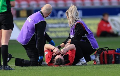 090325  Brython Thunder v Glasgow Warriors, Celtic Challenge - Cadi Lois Davies of Brython Thunder receives treatment for an injury before being stretchered off