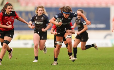 201225 - Brython Thunder v Glasgow Warriors, Celtic Challenge - Gemma Bell is held by Jess Rogers of Brython Thunder