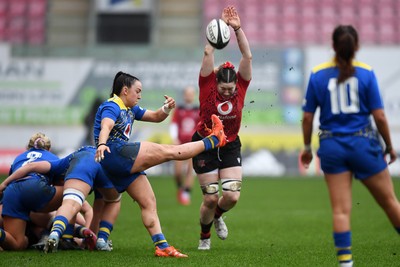 080326 - Brython Thunder v Gwalia Lightning - Celtic Challenge - Sian Jones of Gwalia Lightning kicks the ball into the path of Gwen Crabb of Brython Thunder