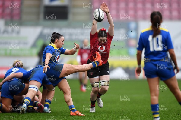 080326 - Brython Thunder v Gwalia Lightning - Celtic Challenge - Sian Jones of Gwalia Lightning kicks the ball into the path of Gwen Crabb of Brython Thunder