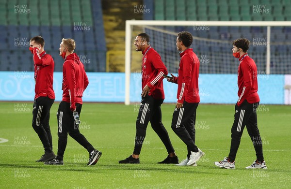 141020 - Bulgaria v Wales - UEFA Nations League - Ben Cabango of Wales laughs with team mates as they arrive at the stadium