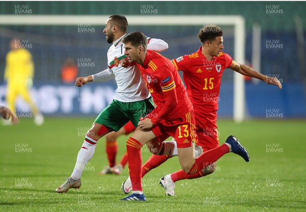 141020 - Bulgaria v Wales - UEFA Nations League - Georgi Yomov of Bulgaria is tackled by Chris Mepham of Wales