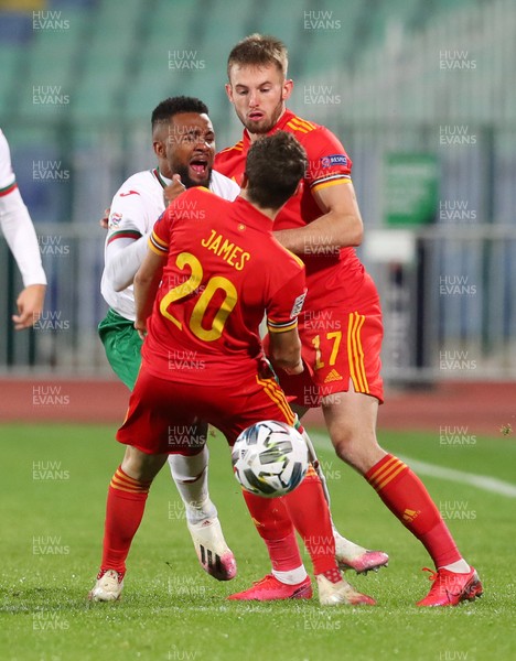 141020 - Bulgaria v Wales - UEFA Nations League - Daniel James of Wales collides with Cicinho of Bulgaria, which James receives a yellow card