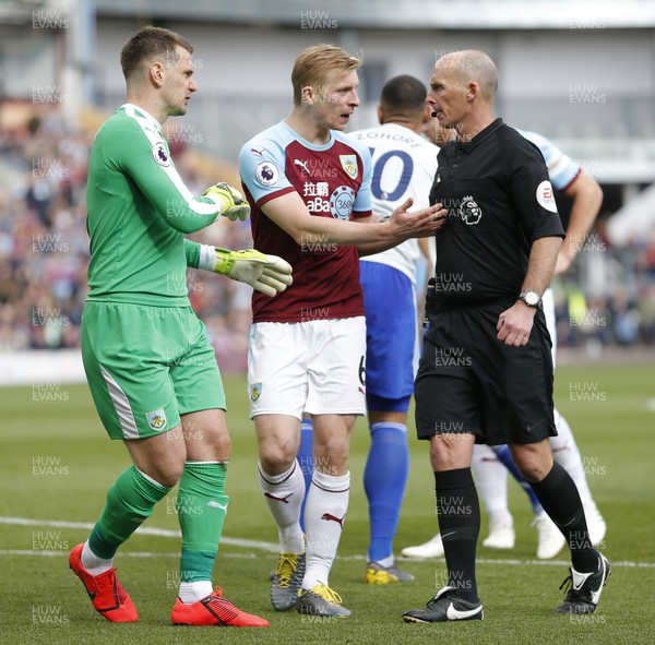 130419 - Burnley v Cardiff City - Premier League -  Protests from goalkeeper Thomas Heaton and Ben Mee of Burnley as referee Michael Dean awards a penalty