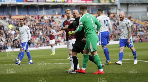 130419 - Burnley v Cardiff City - Premier League -  Protests from goalkeeper Thomas Heaton and Ben Mee of Burnley as referee Michael Dean awards a penalty