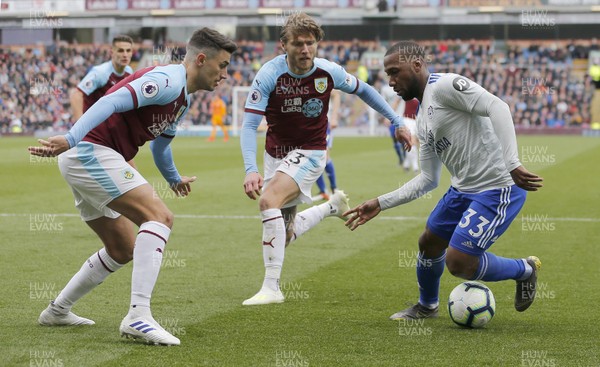 130419 - Burnley v Cardiff City - Premier League -  Junior Hoilett of Cardiff tries to edge past Matthew Lowton of Burnley and Jeff Hendrick of Burnley