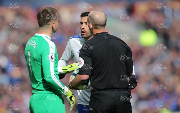 130419 - Burnley v Cardiff City - Premier League -  Victor Camarasa of Cardiff argues with Burnley goalkeeper Thomas Heaton and referee Mike Dean over the penalty decision being overturned
