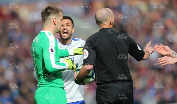 130419 - Burnley v Cardiff City - Premier League -  Victor Camarasa of Cardiff argues with Burnley goalkeeper Thomas Heaton and referee Mike Dean over the penalty decision being overturned