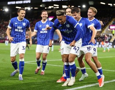 230925 - Burnley v Cardiff City - Carabao Cup Third Round - Callum Robinson of Cardiff cele on goal in 1st half with Rubin Colwill of Cardiff and Cian Ashford of Cardiff and team doing some kind of dance