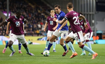 230925 - Burnley v Cardiff City - Carabao Cup Third Round - Ryan Wintle of Cardiff is surrounded by Burnley players