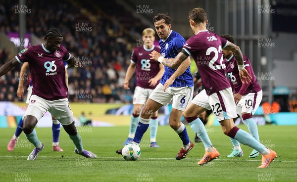 230925 - Burnley v Cardiff City - Carabao Cup Third Round - Ryan Wintle of Cardiff is surrounded by Burnley players