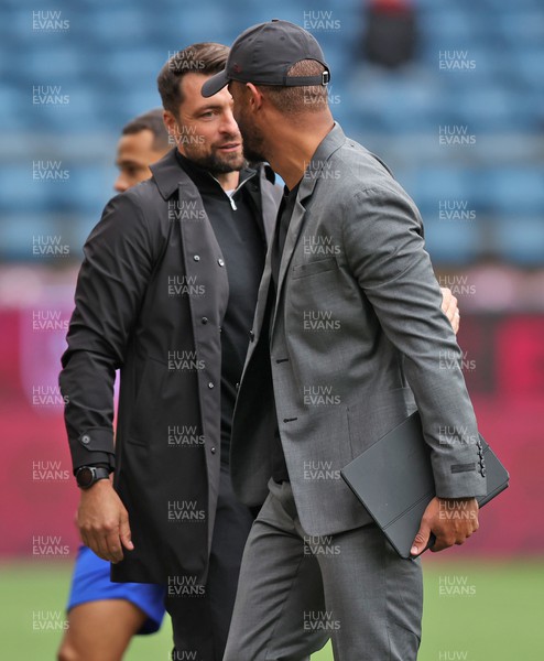 151022 - Burnley v Swansea City - Sky Bet Championship - Burnley Manager Vincent Kompany at the start of the match greets Head Coach Russell Martin  of Swansea