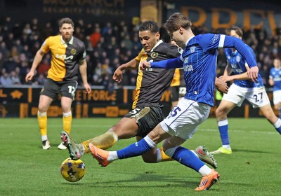 310126 - Burton Albion v Cardiff City - Sky Bet League 1 - Cian Ashford of Cardiff tries a shot on goal but is blocked by Kyran Lofthouse of Burton Albion
