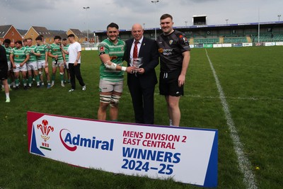 260425 - Caerphilly v Taffs Well - Admiral National League 2 East Central -  Roy Wilkinson of Welsh Rugby Union presents trophy to Caerphilly RFC captain Sam Haley (in black) and captain of todays match Tom Axenderrie